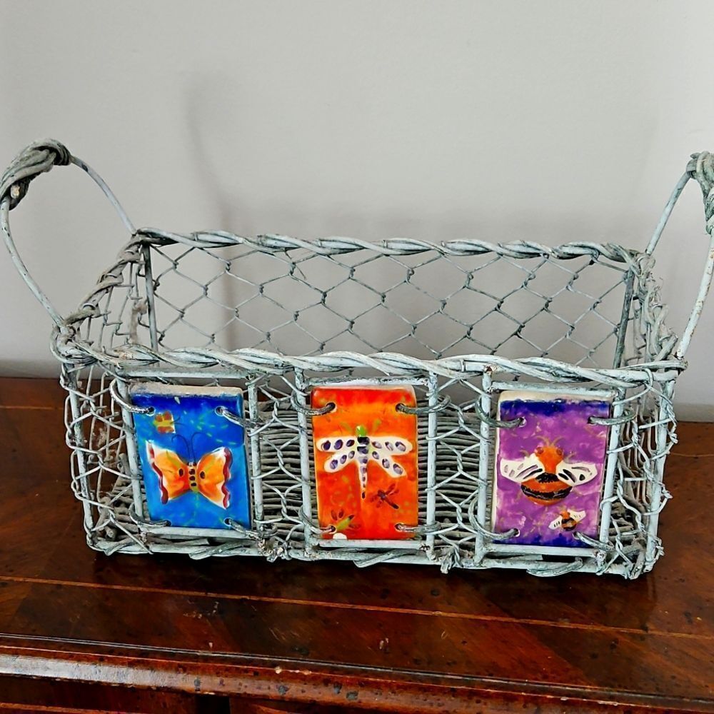 Vintage basket decorated with ceramic tiles